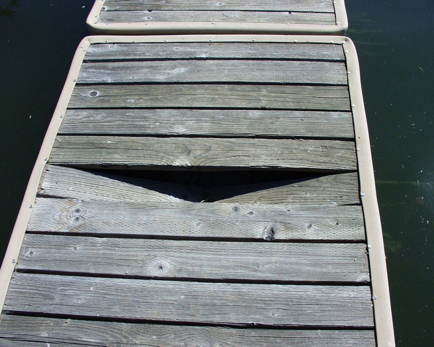 May contain: water, waterfront, pier, port, boardwalk, bridge, and wood